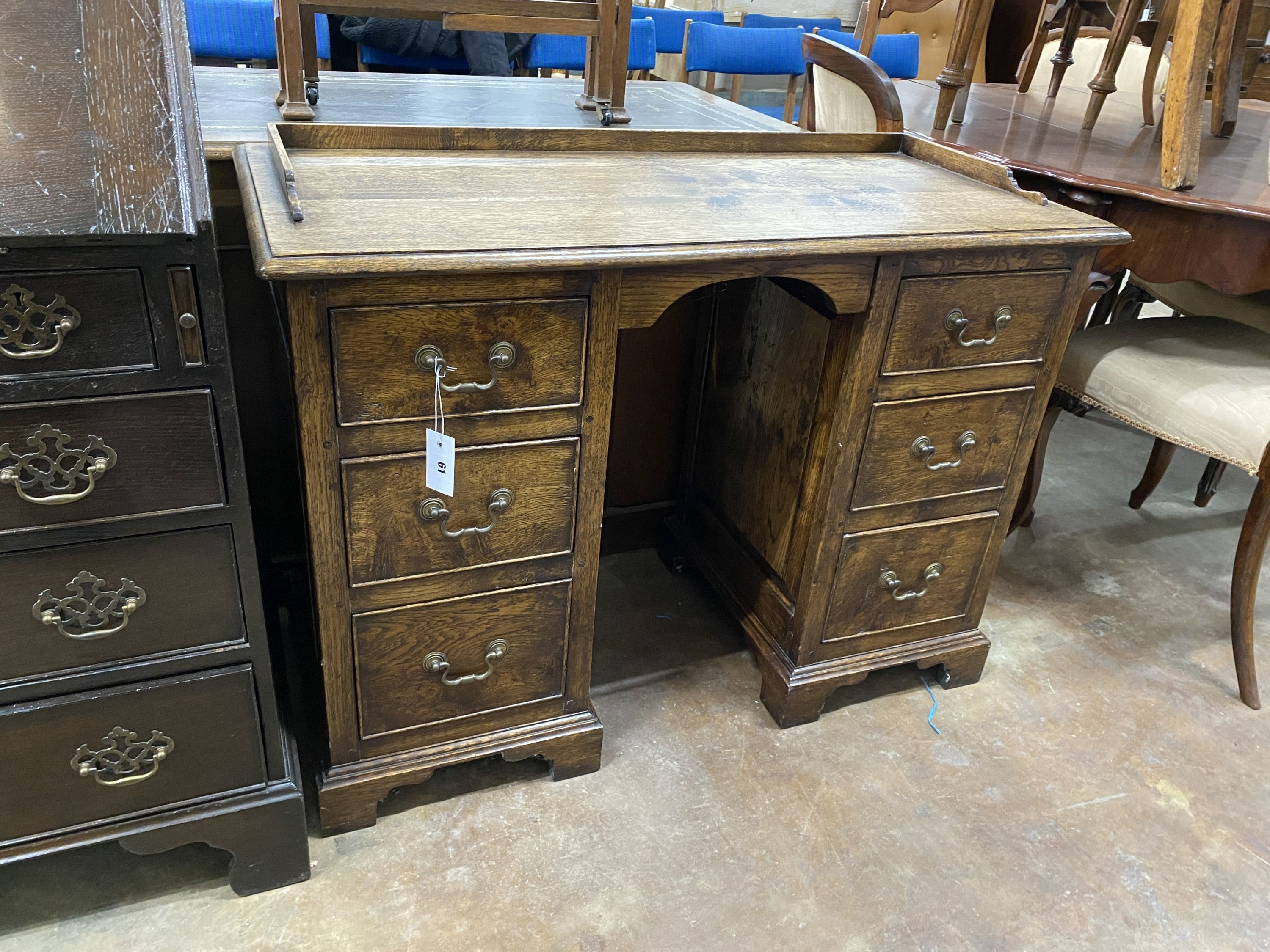 An 18th century style oak kneehole desk, width 103cm, depth 48cm, height 78cm